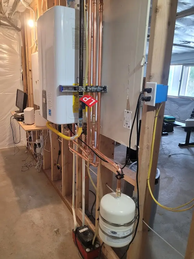 Licensed plumber repairing a kitchen sink in Rathdrum